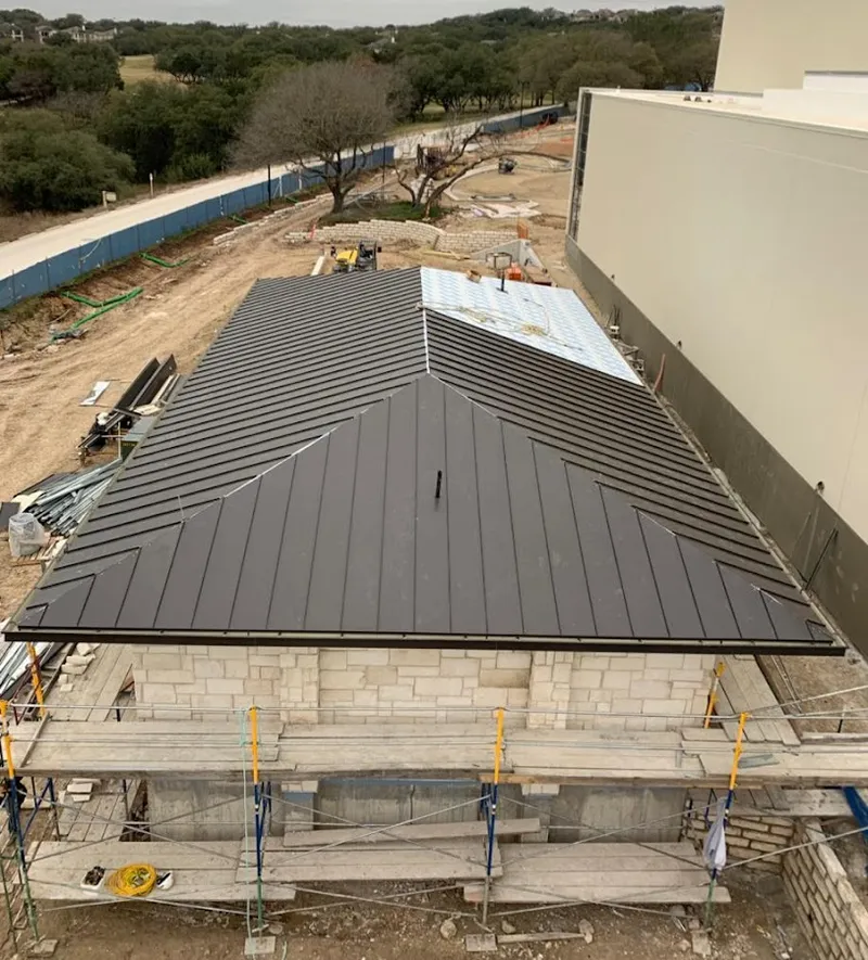 Metal roof new construction with scaffolding in Altus
